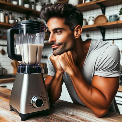 Photo of a man gazing deeply at a blender